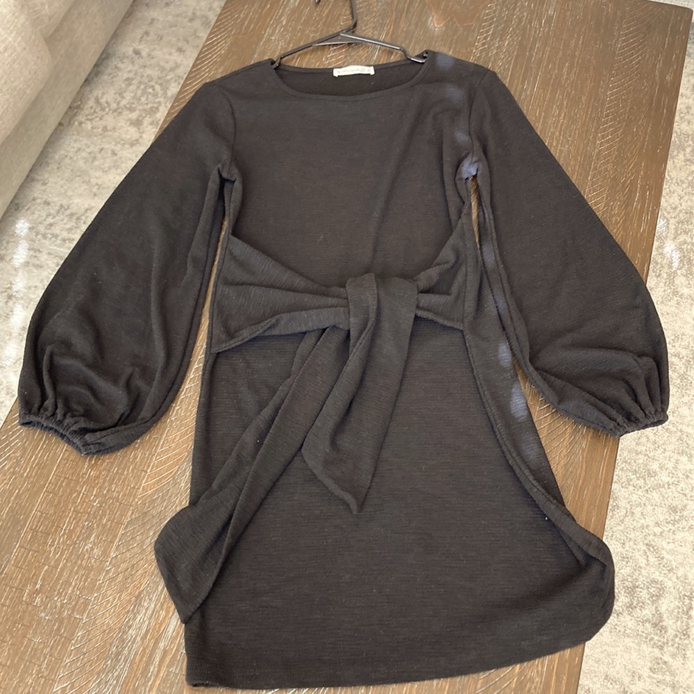 Size Small. Tie across black balloon sleeve dress.